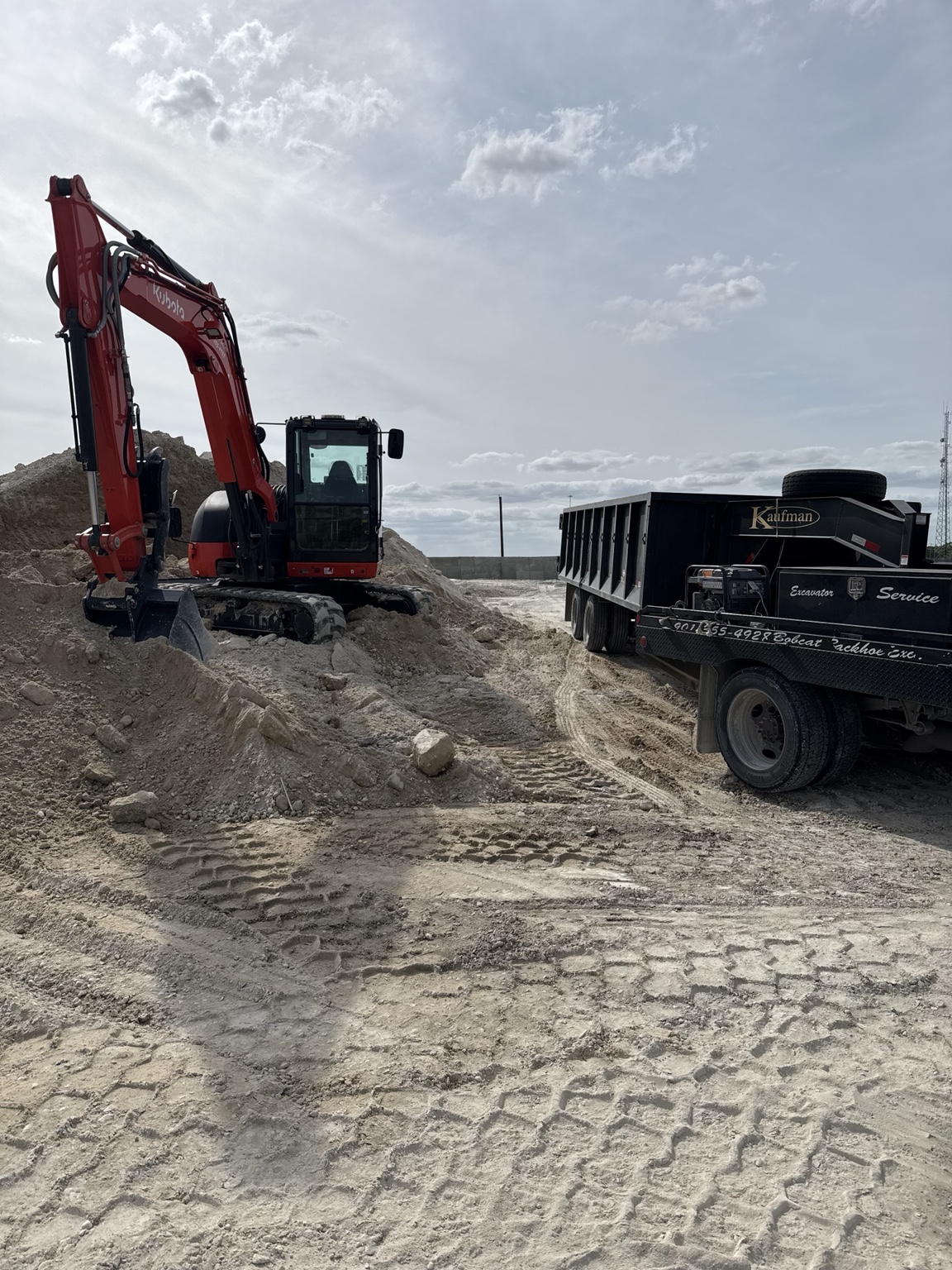 Excavator working on a dirt project in West Memphis